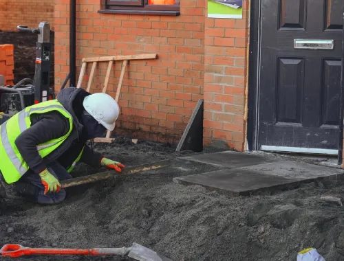 Construction team in Wednesbury carrying out groundworks and foundation preparation in an area with historic coal mining activity.